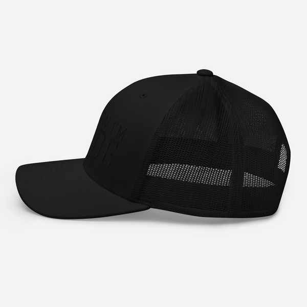 MADE Tagline Black Trucker Cap